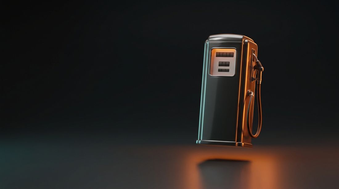 A retro gas pump glowing orange in the dark — there's still more gas in the tank
